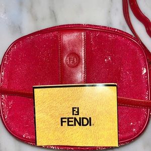 Red Fendi crossbody with significant discoloration from age